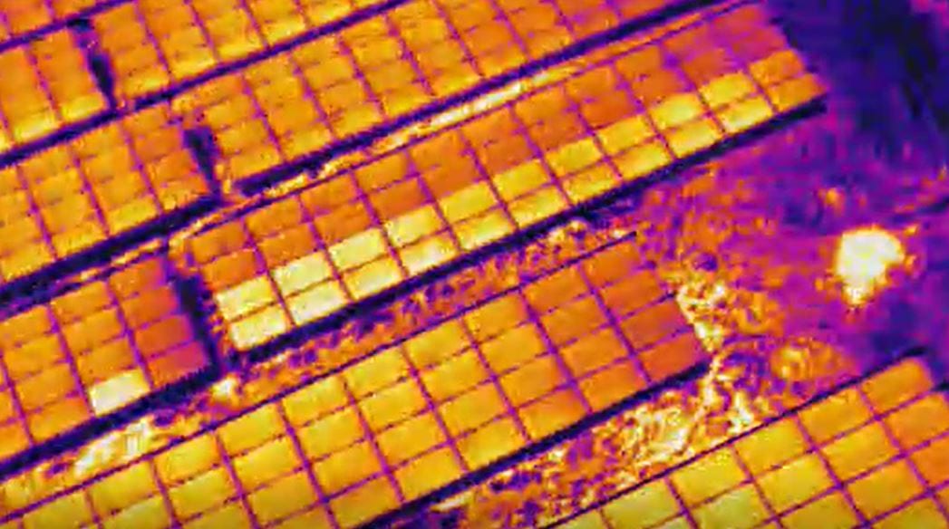 Thermal image of solar module rows showing a distinct hot spot on the right side