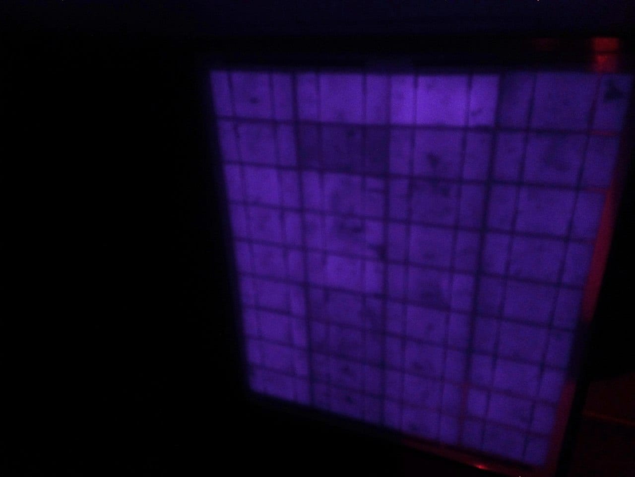 A low-resolution, blurred electroluminescence (EL) photograph