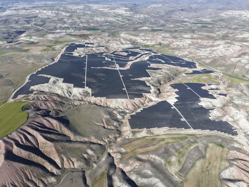 Aerial view of the OYAK Çimento Beypazarı solar plant following the folds of the terrain